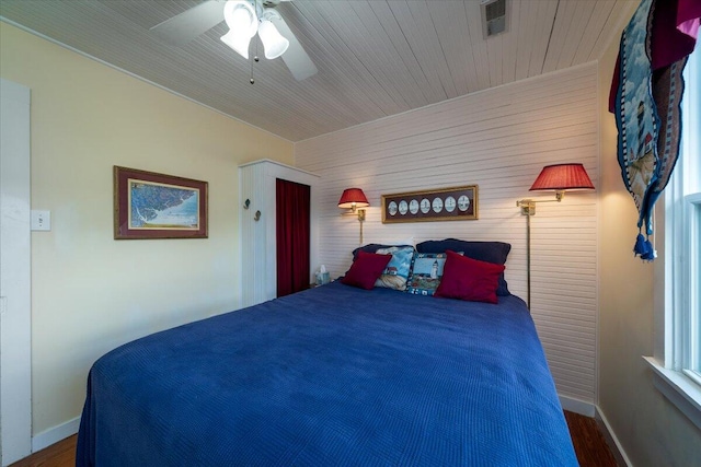 bedroom featuring ceiling fan and dark hardwood / wood-style floors