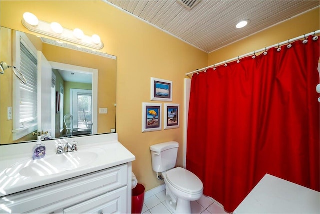 bathroom with vanity, tile patterned floors, and toilet