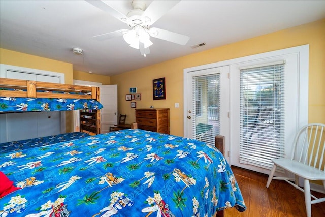 bedroom featuring ceiling fan, access to exterior, and dark hardwood / wood-style floors