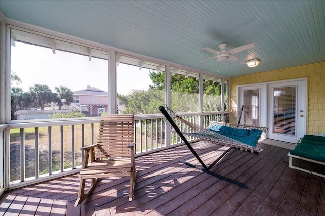 sunroom with a wealth of natural light and ceiling fan