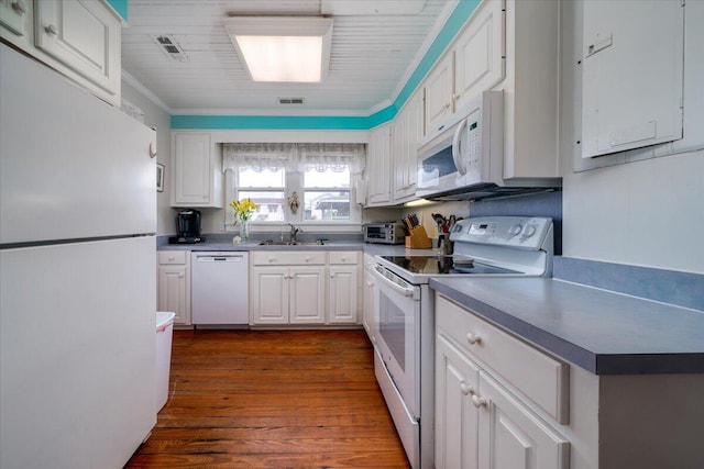 kitchen featuring dark hardwood / wood-style flooring, sink, crown molding, white cabinetry, and white appliances