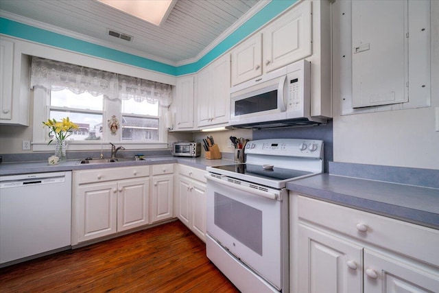 kitchen with ornamental molding, white cabinetry, dark hardwood / wood-style floors, sink, and white appliances