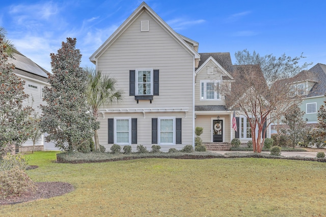 front facade featuring a front yard