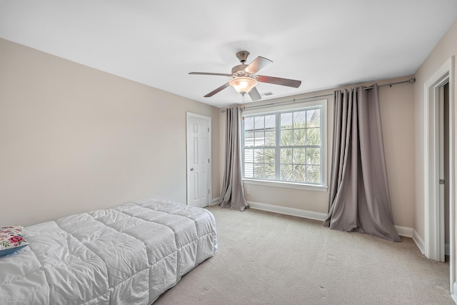 carpeted bedroom with ceiling fan