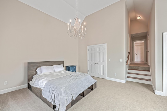 carpeted bedroom with high vaulted ceiling and a notable chandelier