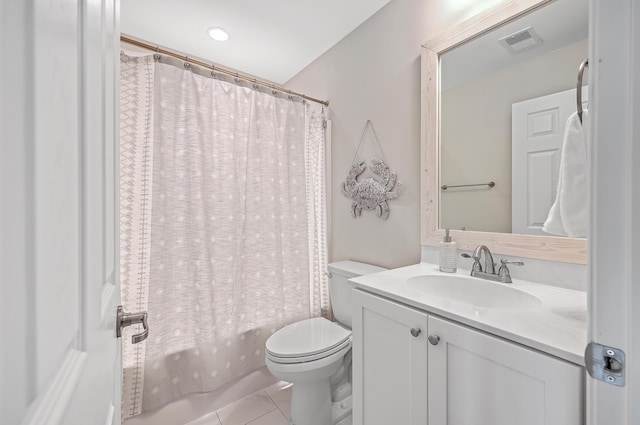 full bathroom featuring toilet, vanity, tile patterned floors, and shower / tub combo with curtain