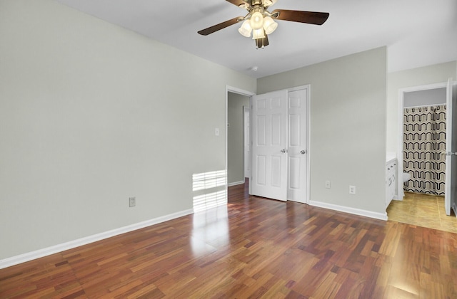 unfurnished bedroom with a ceiling fan, baseboards, and wood finished floors