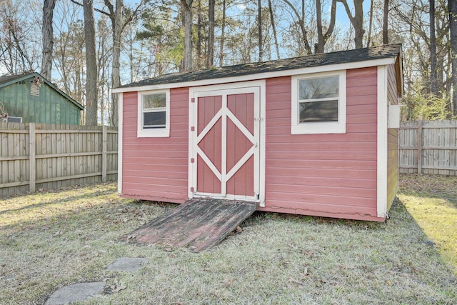 view of shed with a fenced backyard