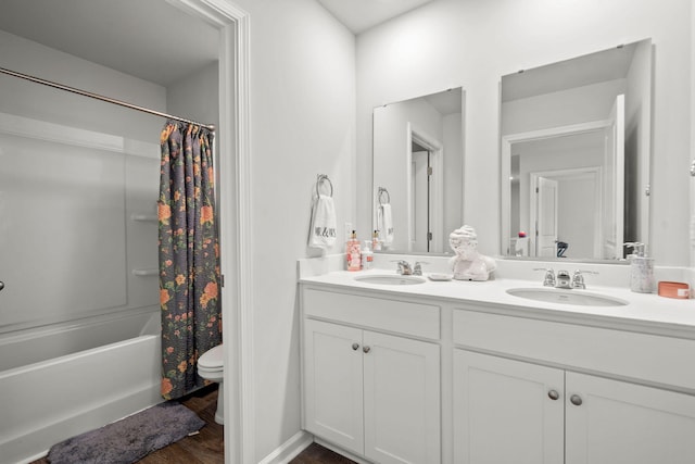 full bathroom with toilet, wood-type flooring, shower / bath combo, and double sink vanity