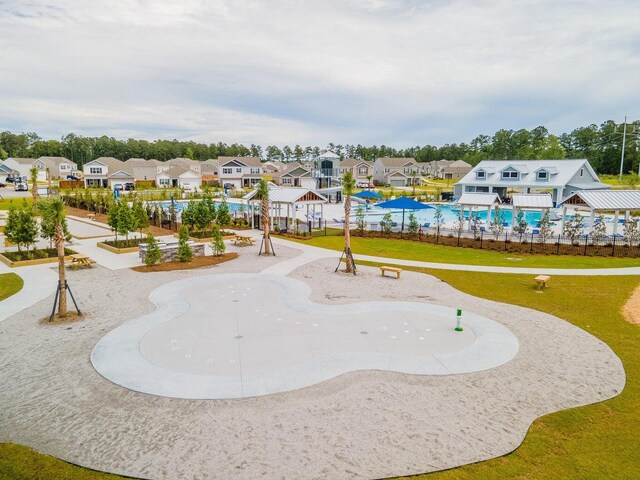 view of pool with a water slide and a patio