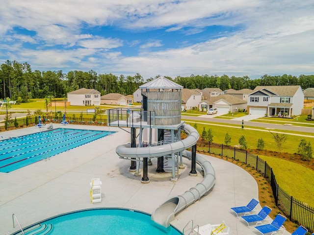 view of pool featuring a patio and a water slide