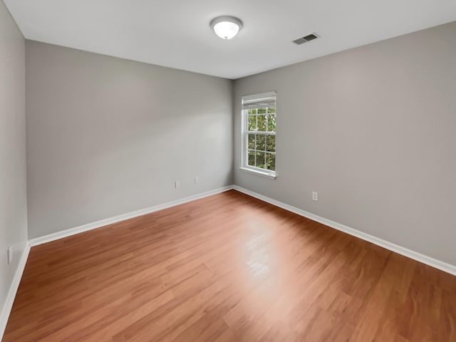 spare room featuring hardwood / wood-style flooring