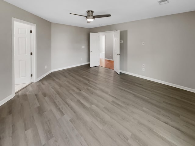 empty room featuring hardwood / wood-style flooring and ceiling fan