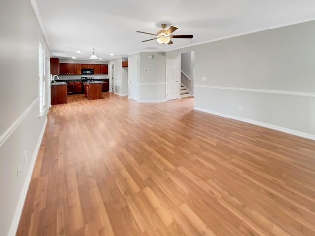 unfurnished living room with light wood-type flooring, ceiling fan, and crown molding