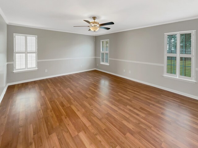 unfurnished room featuring ceiling fan, ornamental molding, and hardwood / wood-style floors