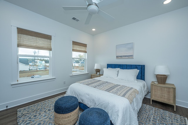 bedroom featuring ceiling fan and dark hardwood / wood-style floors