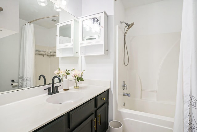 bathroom with shower / bath combo and vanity