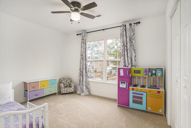 bedroom with carpet floors, a closet, and ceiling fan