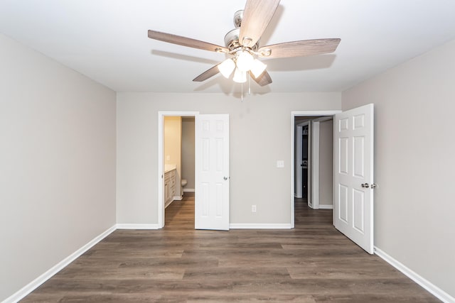 unfurnished bedroom with dark hardwood / wood-style flooring, ceiling fan, and ensuite bathroom