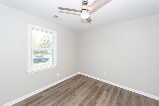 spare room featuring hardwood / wood-style flooring and ceiling fan