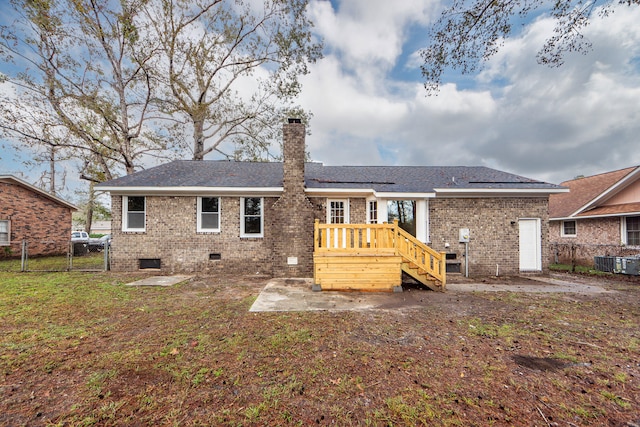 rear view of property with a deck and cooling unit