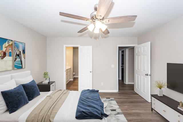 bedroom featuring ensuite bath, ceiling fan, and dark hardwood / wood-style floors