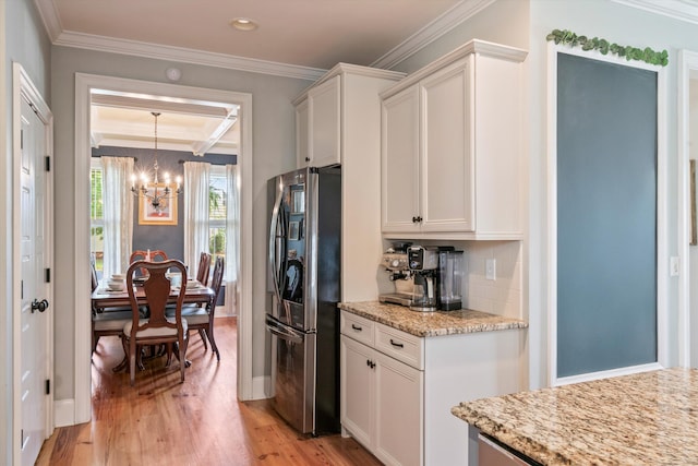 216 Foxbank Plantation Blvd, Moncks Corner, SC 29461 - kitchen featuring freestanding refrigerator, a chandelier, light wood-style floors, crown molding, and white cabinetry