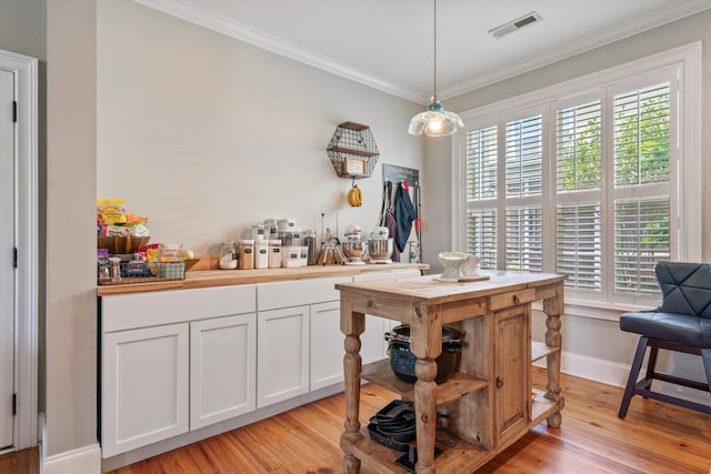 216 Foxbank Plantation Blvd, Moncks Corner, SC 29461 - dining space featuring ornamental molding, light wood-style floors, and baseboards