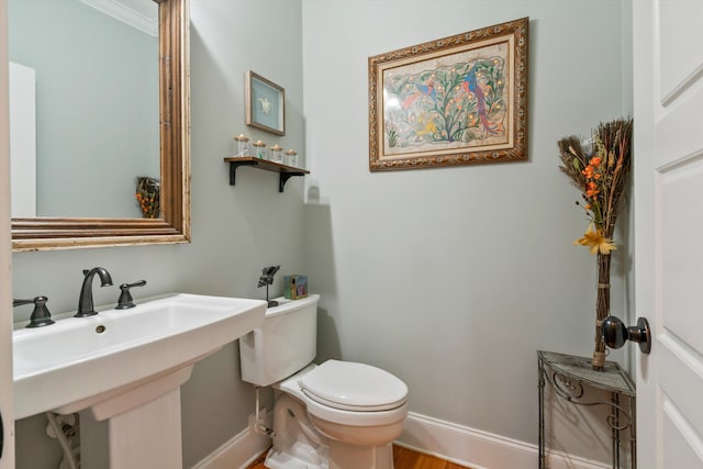 216 Foxbank Plantation Blvd, Moncks Corner, SC 29461 - half bathroom featuring baseboards, toilet, a sink, and wood finished floors