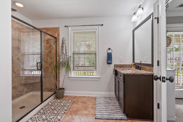 216 Foxbank Plantation Blvd, Moncks Corner, SC 29461 - bathroom featuring vanity, a stall shower, baseboards, and tile patterned flooring