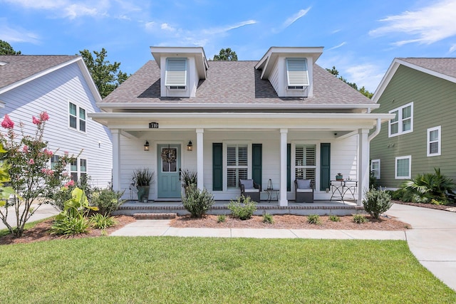 view of front of home with a front lawn and a porch