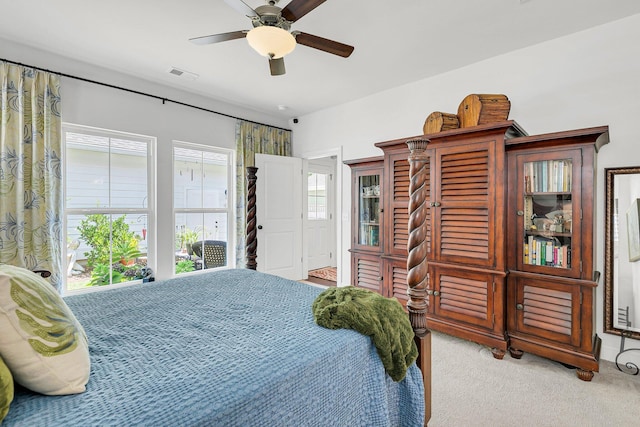 bedroom with light carpet and ceiling fan