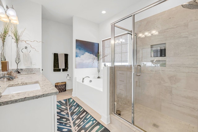 bathroom featuring vanity and separate shower and tub