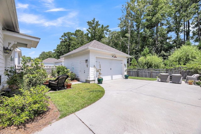 garage featuring a lawn