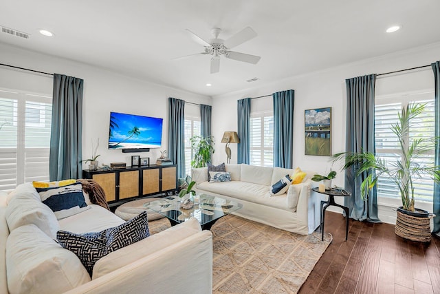 living room featuring crown molding, ceiling fan, and wood-type flooring