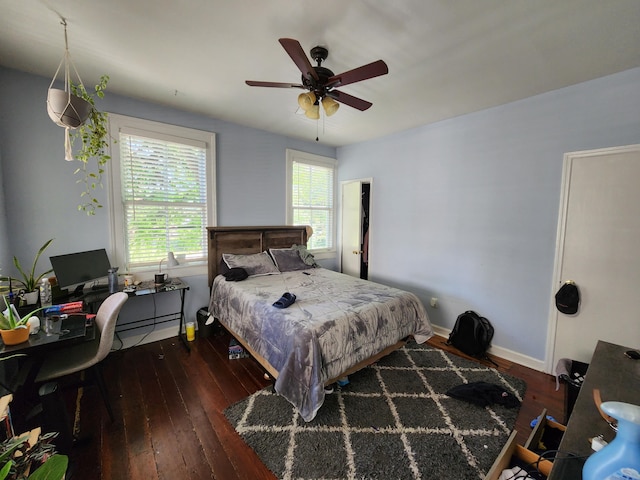 bedroom featuring ceiling fan and dark hardwood / wood-style flooring