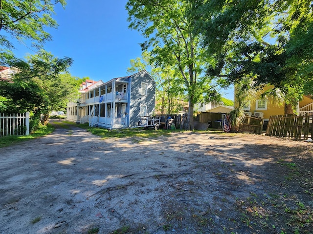 back of house featuring a balcony