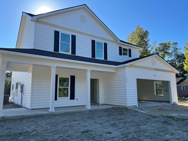 view of front of property with a porch and cooling unit