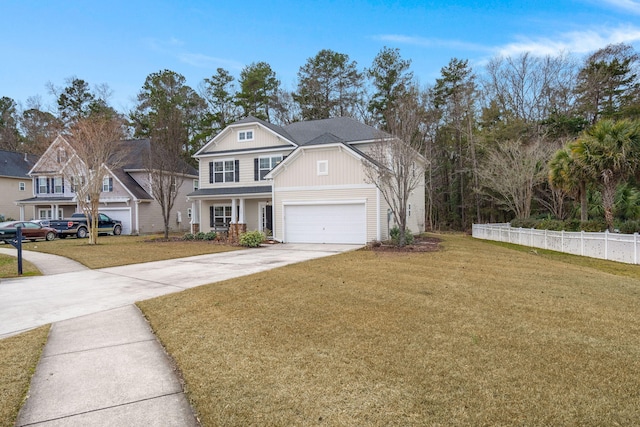 view of front of property featuring a front yard and a garage