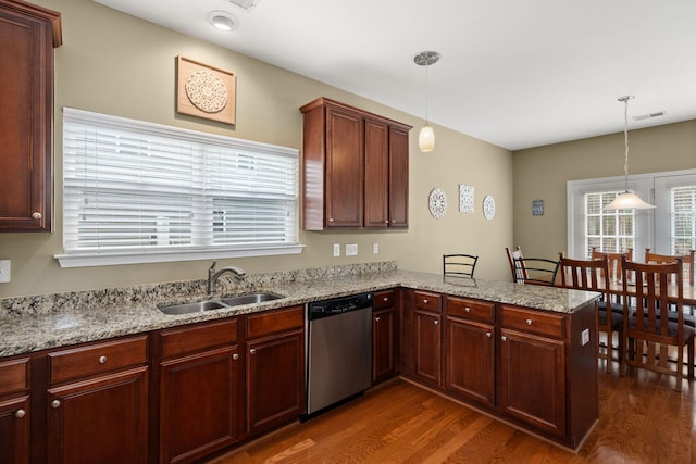 kitchen with visible vents, a sink, a peninsula, stainless steel dishwasher, and dark wood-style flooring