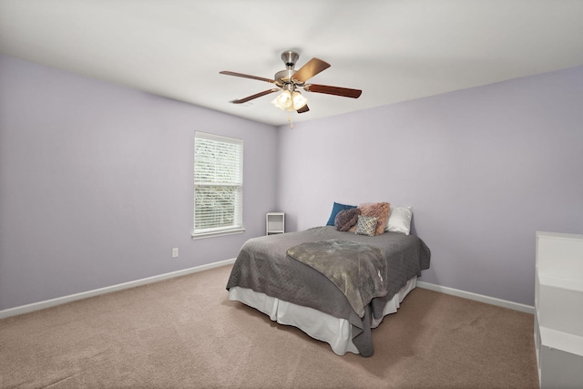 bedroom with baseboards, carpet, and a ceiling fan