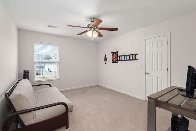 living area with visible vents, a ceiling fan, baseboards, and carpet floors