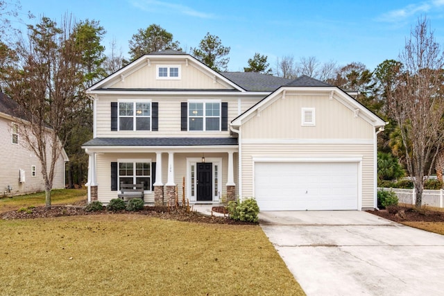 craftsman-style home with a front yard, driveway, roof with shingles, a porch, and a garage