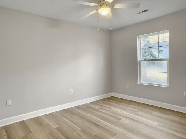 empty room with ceiling fan and light wood-type flooring