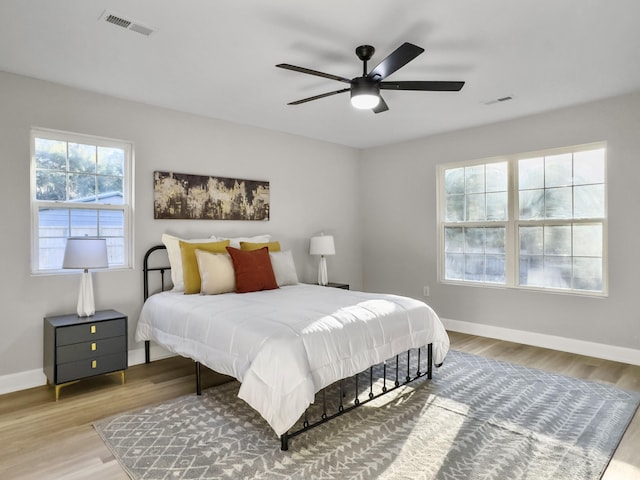 bedroom featuring light hardwood / wood-style flooring and ceiling fan