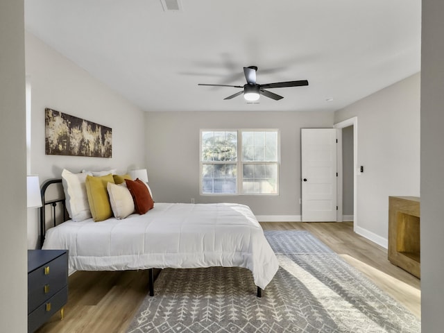 bedroom featuring hardwood / wood-style floors and ceiling fan