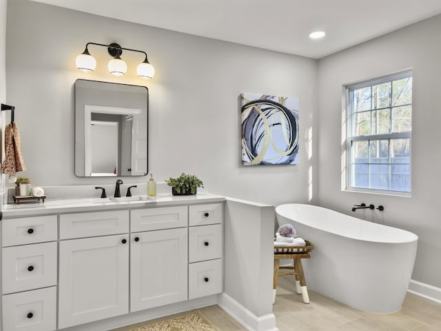 bathroom featuring vanity and a bathtub