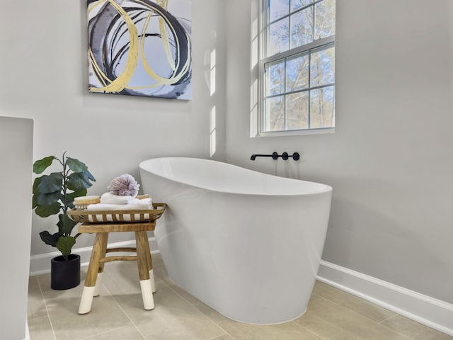 bathroom featuring tile patterned floors and a bathtub