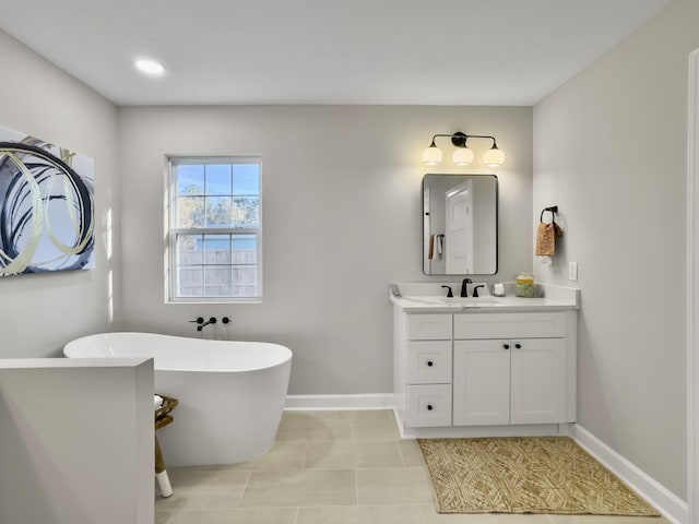 bathroom featuring vanity, tile patterned floors, and a bathing tub