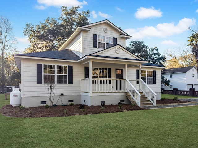 view of front of property with a front lawn and covered porch